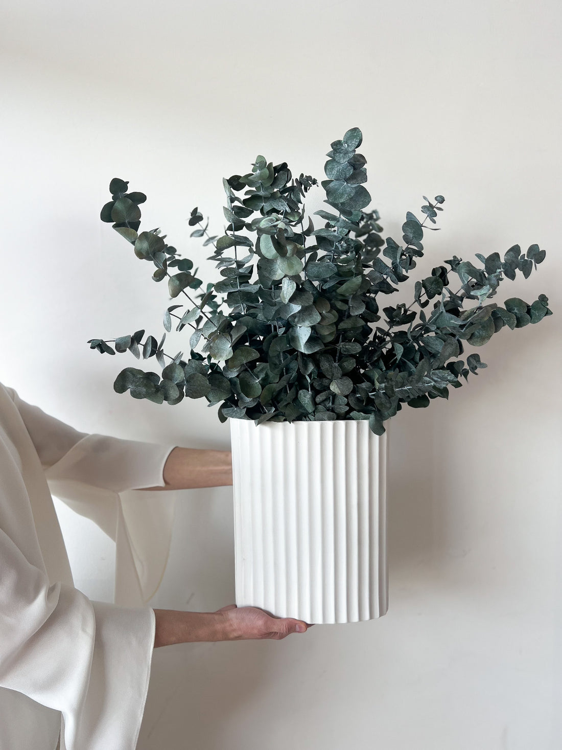 THE CHRISTMAS CENTREPIECE, PRESERVED GUM EN MASSE IN WHITE RIPPLE VASE