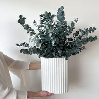 THE CHRISTMAS CENTREPIECE, PRESERVED GUM EN MASSE IN WHITE RIPPLE VASE
