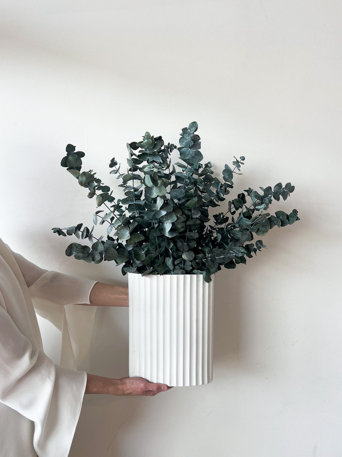 THE CHRISTMAS CENTREPIECE, PRESERVED GUM EN MASSE IN WHITE RIPPLE VASE