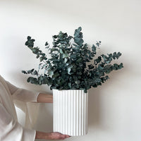 THE CHRISTMAS CENTREPIECE, PRESERVED GUM EN MASSE IN WHITE RIPPLE VASE