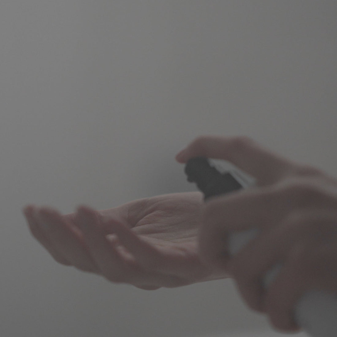 SALUS body oil dispensed in hand