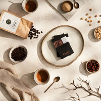 Cuvée Espresso Hazelnut Crunch chocolate bar broken to show hazelnut filling