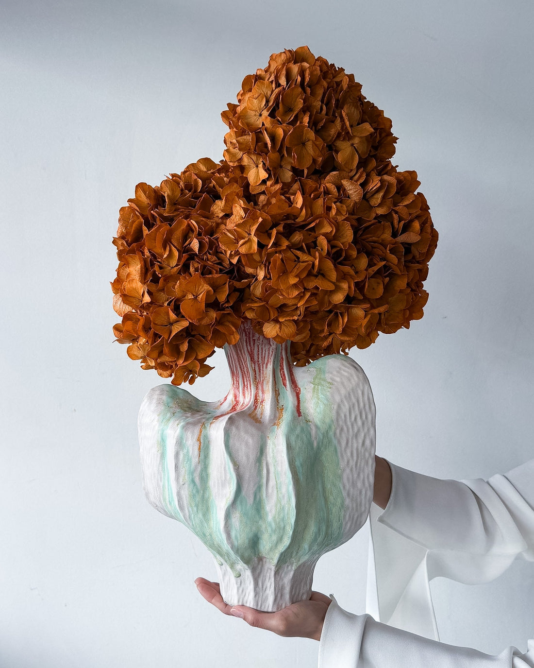 ALODIA preserved orange hydrangea arrangement in Noto vessel