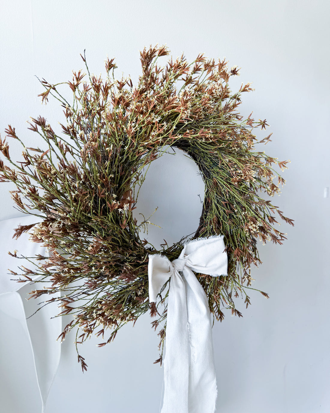 - DRIED STARRY WREATH WITH WHITE BOW -