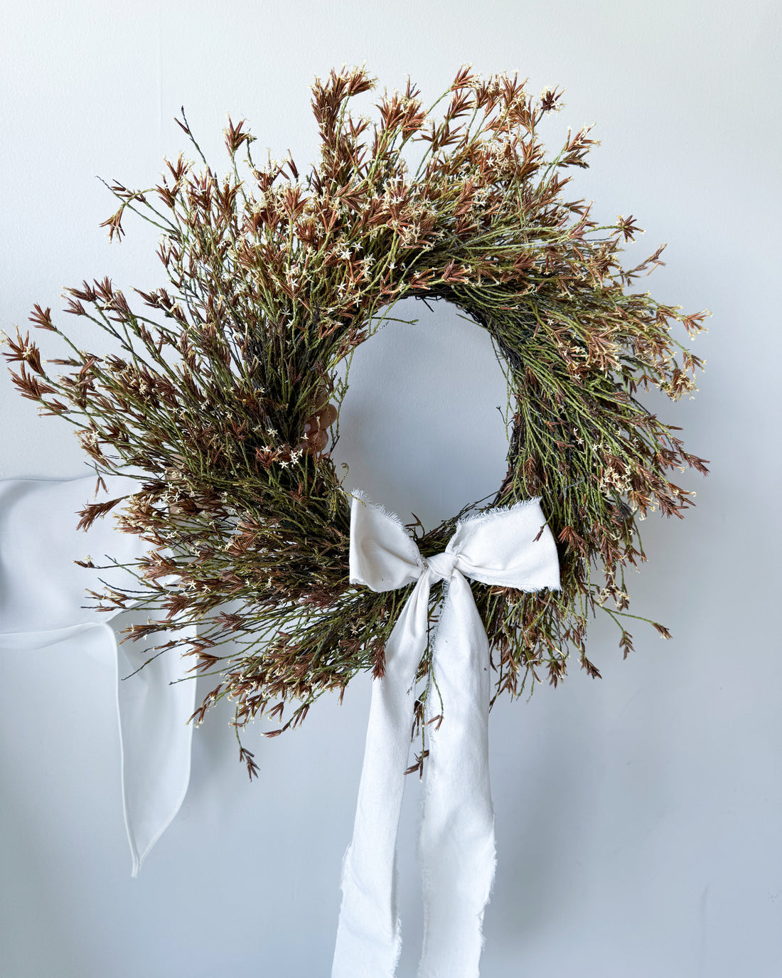 - DRIED STARRY WREATH WITH WHITE BOW -