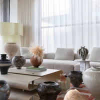 The Palmier vase collection styled in a living room