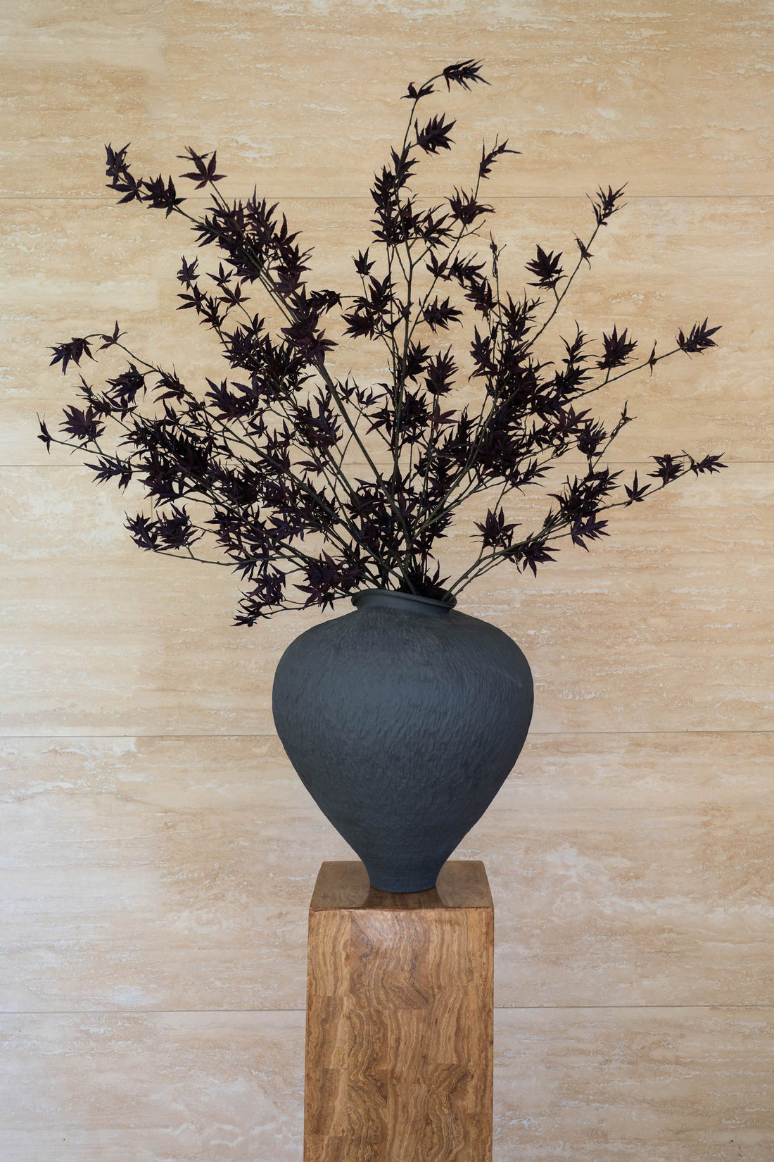 EVE faux deep burgundy Japanese maple in Siwa vessel by The Palmier, on a timber plinth