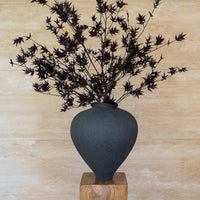 EVE faux deep burgundy Japanese maple in Siwa vessel by The Palmier, on a timber plinth