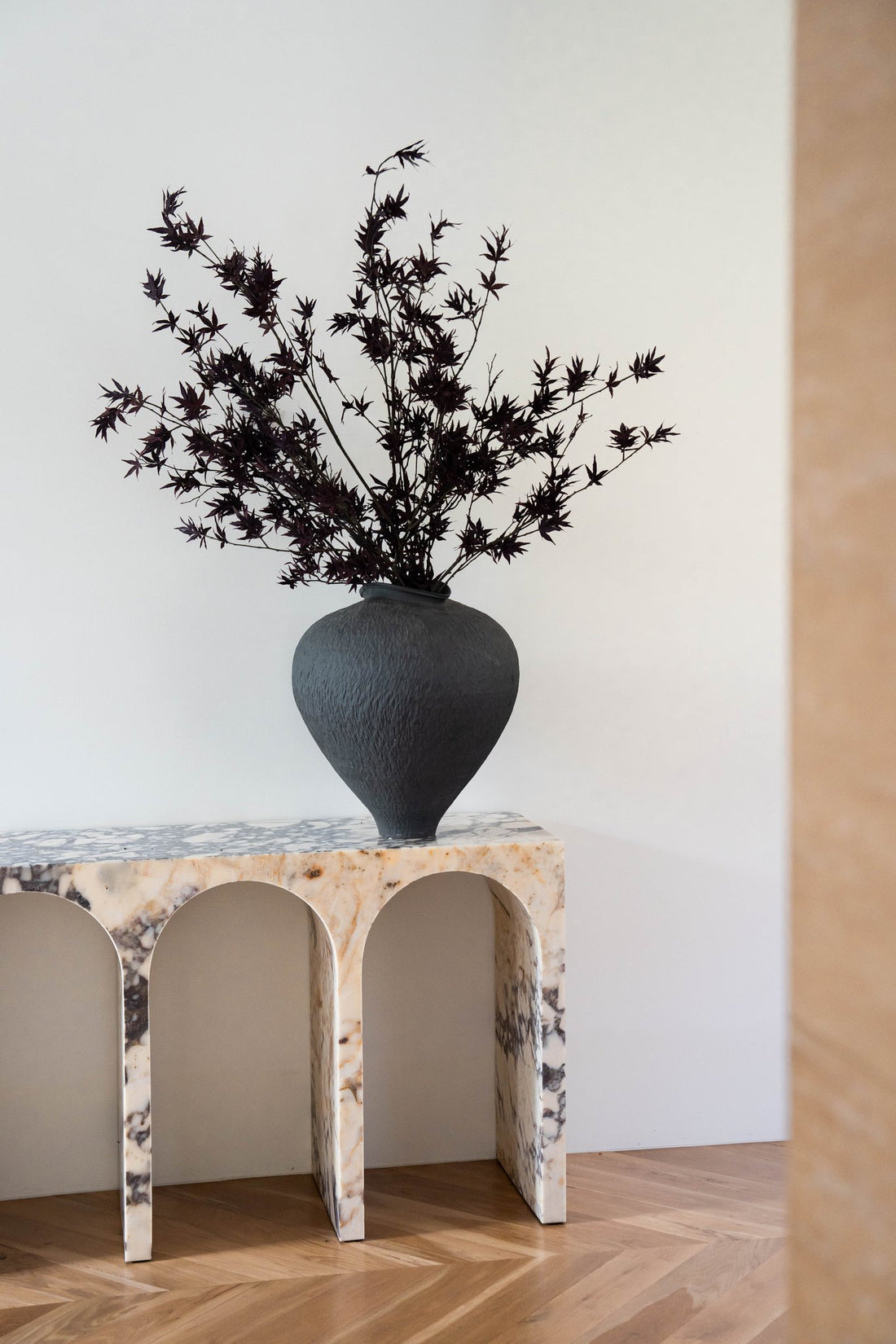 EVE faux Japanese maple in Siwa vessel styled on a stone console