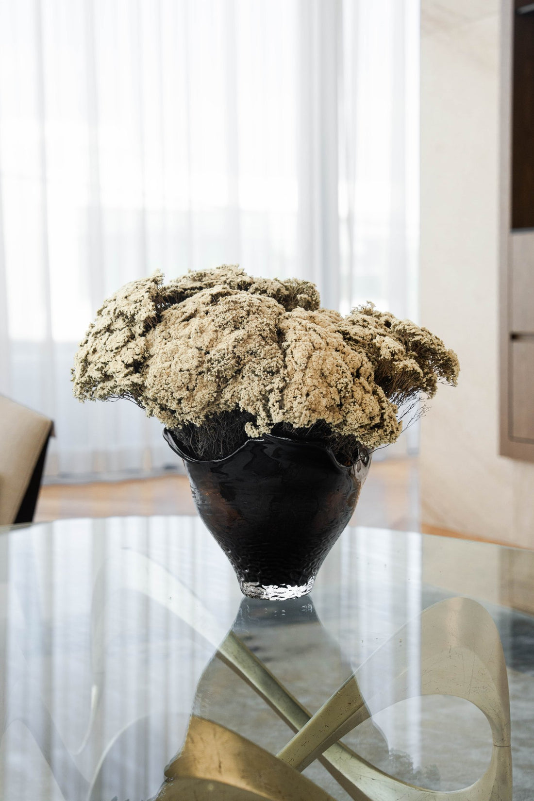 MARIA pale golden preserved morrison en masse in black Lashay vessel by The Palmier, on a dining table